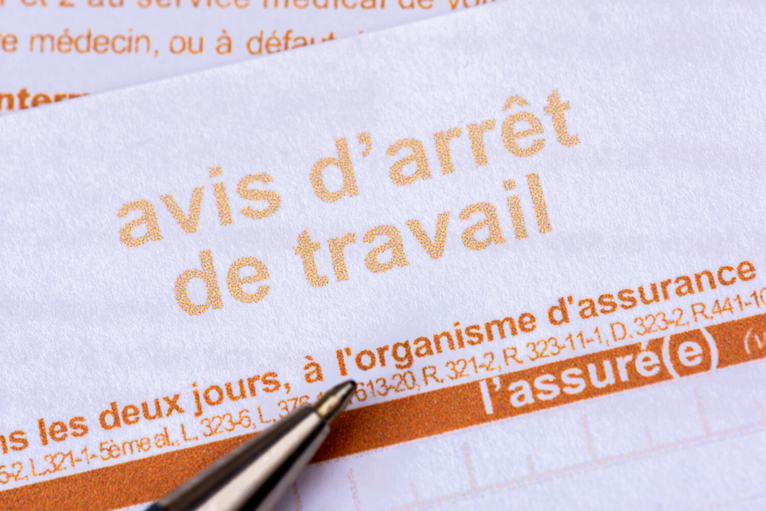 Close-up of an official sick leave form from the French social security