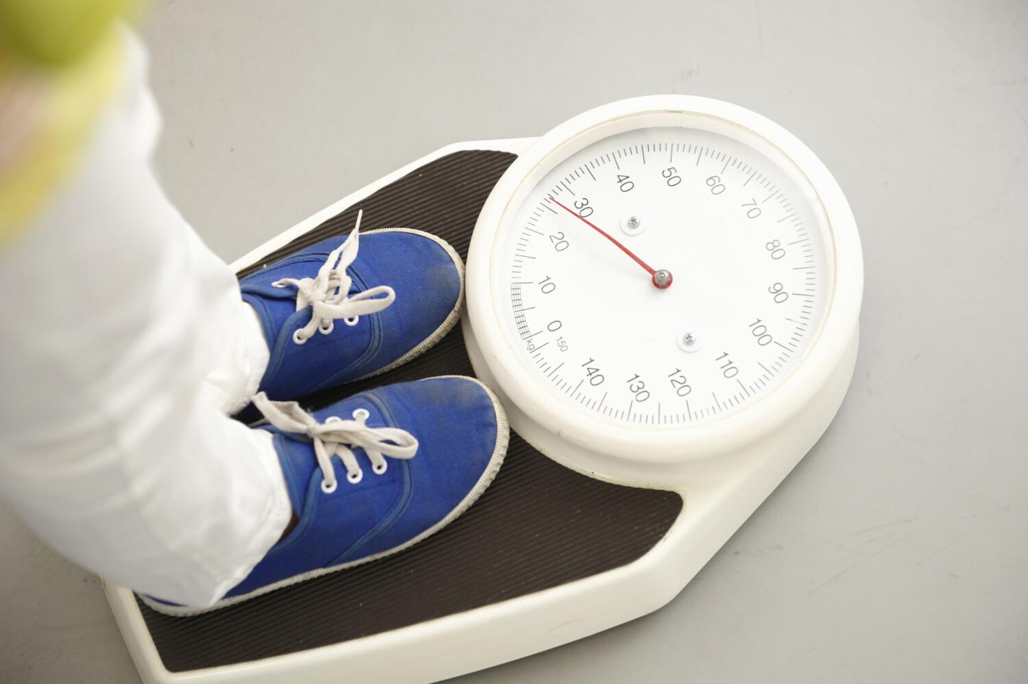 Child’s feet on scales