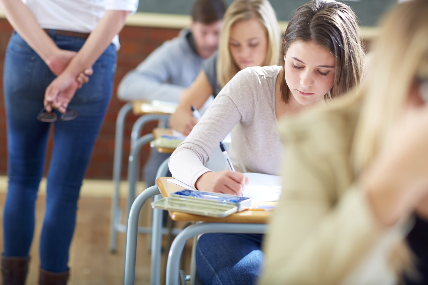 Students in classroom having an exam