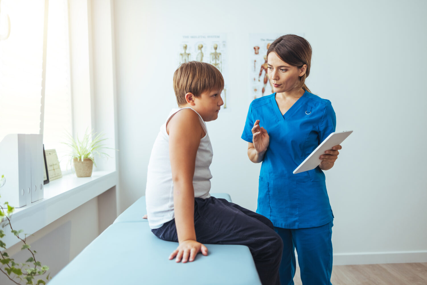 Lovely nurse take care of child at clinic